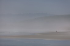 Holly lost in sea mist at Blackhead Beach, Dunedin, New Zealand. 
