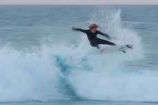 James Murphy takes flight in fun waves at Blackhead Beach, Dunedin, New Zealand. 
