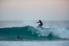Nathan Johnston floating in fun waves at Blackhead Beach, Dunedin, New Zealand. 