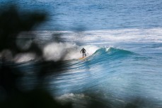 A surfer latches on to a fun wave at St Clair Beach, Dunedin, New Zealand. 