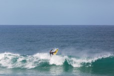 A surfer floats a section at St Clair Beach, Dunedin, New Zealand. 