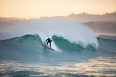Tash Mattingley making the most of fun waves at Blackhead Beach, Dunedin, New Zealand. 