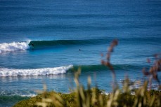 Clean lines as a new ground swell wraps into Blackhead Beach, Dunedin, New Zealand. 