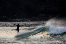 Evie Hall walking to the nose at Blackhead Beach, Dunedin, New Zealand. 