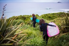 Joe Wilson and Evie Hall head out for a dawnie in fun waves at Blackhead Beach, Dunedin, New Zealand. 