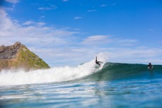 Lyndon Fairbairn throwing his fins in fun waves at Blackhead Beach, Dunedin, New Zealand. 