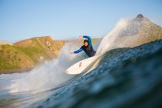 Ben Bennett slices up a wall in hollow little waves at Blackhead Beach, Dunedin, New Zealand. 