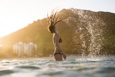 Skinnies ambassador Kristin Crook soaks in the early summer sunshine at Main Beach, Mount Maunganui, Bay of Plenty, New Zealand. 