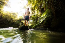 Lewis Ryan relaxes after a busy season, racing Xterra throughout the world, in his home in Rotorua on the Kaituna River, Okere, Bay of Plenty, New Zealand. 