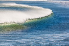 Swell lines wrap into Shelley Beach near Aramoana, Dunedin, New Zealand. 