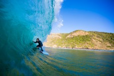Jordan brushing the wall in fun waves at a remote beach on Otago Peninsula, Dunedin, New Zealand. 