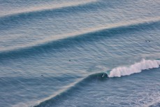 Swell lines wrap into the North Coast, Dunedin, New Zealand. 