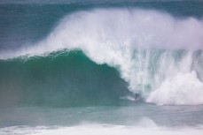 Big wave surfer, Delta, takes on a storm swell in the Catlins, Otago, New Zealand. 