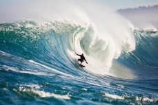 Doug Young masterful at a remote reef break on the Otago coast, New Zealand. 