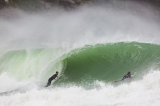 A surfer looks for the barrel as an offshore wind feathers fun waves at a remote Catlins' beach, Catlins, New Zealand. 