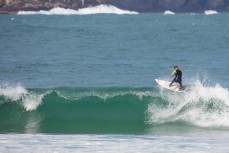 Jack McLeod floats a section in fun waves on the Otago Peninsula, Dunedin, New Zealand.