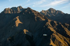 Colin Nimmo flies the Cessna 180 at dawn over Muzzle Station, Kaikoura, New Zealand.