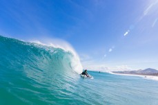 Elliott Brown grabs his rail as a wave peaks at Blackhead Beach, Dunedin, New Zealand. 