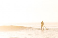 Summer morning paddleboard at St Clair Beach, Dunedin, New Zealand. 