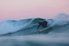 A surfer makes the most of fun dusk conditions at St Clair, Dunedin, New Zealand.