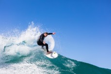 Brad Melville off the top in calm, clean conditions at Blackhead Beach, Dunedin, New Zealand.