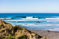 Surfers make the most of calm, clean conditions at Blackhead Beach, Dunedin, New Zealand.