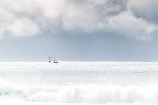 A fishing boat battles swell at Aramoana, Dunedin, New Zealand.