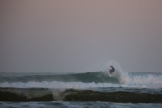 Damian Phillips on turn number 5 during a fun session in fun waves at dusk near Brighton, Dunedin, New Zealand.