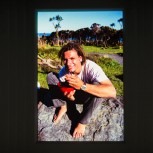 Andy Sutherland dining on freshly harvested paua at Whiterock during the early days of surf exploration around the Wairarapa Coast, Wairarapa, New Zealand. Derek Morrison Archives 1993-1996