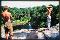 Derek Searancke and Ian Ferguson at Rainbow Falls on a flat day during Northland surf exploration in the Bay of Islands, New Zealand. Derek Morrison Archives 1993-1996