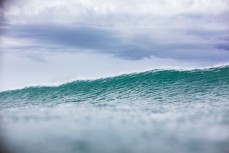 Offshore conditions and fun waves at a beachbreak near Raglan, New Zealand.