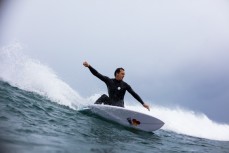 Brett Wood on rail in offshore conditions and fun waves at a beachbreak near Raglan, New Zealand.