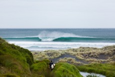 Offshore conditions and fun waves at a beachbreak near Raglan, New Zealand.
