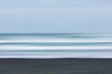 Offshore conditions and fun waves at a beachbreak near Raglan, New Zealand.