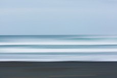 Offshore conditions and fun waves at a beachbreak near Raglan, New Zealand.