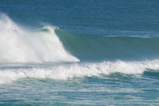 Late drop in testing waves during a new swell at St Kilda, Dunedin, New Zealand.