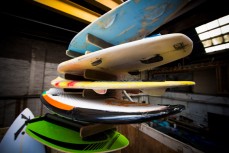 AirWave designer Ross McCarthy and surfer Madoc Barclay test the pre-production version of the wave pool in a warehouse in Dunedin, New Zealand. 