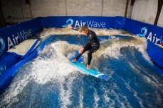 AirWave designer Ross McCarthy and surfer Madoc Barclay test the pre-production version of the wave pool in a warehouse in Dunedin, New Zealand. 