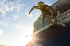 A giant surfer statue at Colac Bay near Riverton, Southland, New Zealand.