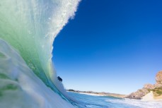 A surfer makes the most of fun winter waves at Aramoana, Dunedin, New Zealand.
