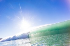 A surfer gets tubed at Aramoana, Dunedin, New Zealand.