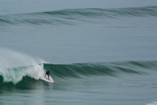 A surfer revels in conditions at Blackhead Beach, Dunedin, New Zealand.