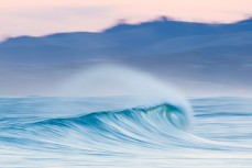 Speed blur in fun, rampy waves at Blackhead Beach, Dunedin, New Zealand.