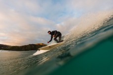 Jason Low harvesting fun, rampy waves at Blackhead Beach, Dunedin, New Zealand.