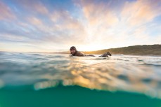 Jason Low all smiles in fun, rampy waves at Blackhead Beach, Dunedin, New Zealand.