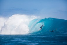 Jonas Tawharu gets barrelled as Caleb Cutmore watches on during a testing day at Cloudbreak during the 2017 Fiji Launch Pad event held In the Mamanuca Islands, Fiji.