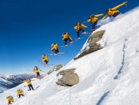 The North Face athlete Sam Smoothy spins off a rock near the summit at Treble Cone Ski Resort, Wanaka, Central Otago, New Zealand.