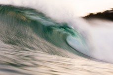 New swell brings clean lines and waves on dusk at St Clair, Dunedin, New Zealand.