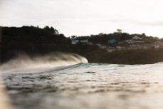 New swell brings clean lines and waves on dusk at St Clair, Dunedin, New Zealand.