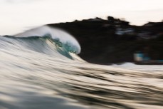New swell brings clean lines and waves on dusk at St Clair, Dunedin, New Zealand.